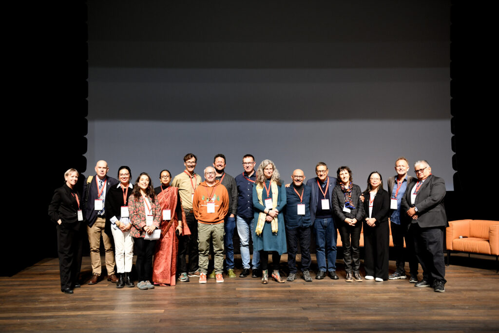 16 of the 20 TICCIH Board members for the term 2025-28 posing on stage in Kiruna on August 29, 2025, after the TICCIH World Congress 2025 Closing Panel. From left to right: Lucie Morisset, Miles Oglethorpe, Mirhan Damir, Esperanza Rock, Moulshri Joshi, Daniel Schneider (HQ), Francesco Antoniol, Guilherme Pozzer, Bartosz Walczak, Marion Steiner, Camilo Contreras, Massimo Preite, Florence Hachez-Leroy, Hsiao-Wei Lin, Knut Markhus, Humberto Morales. Photo: Clara Trojahn, LTU.